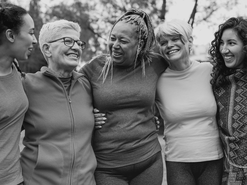 Multi generational women having fun together at park - Multiracial people meet and hugging each other outdoor